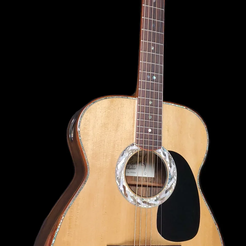 Cutaway acoustic guitar with light wood top, dark pickguard, and abalone rosette.